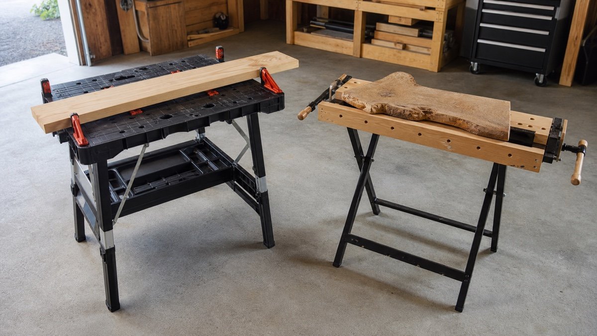 Two portable clamping workbenches open for comparison in a garage