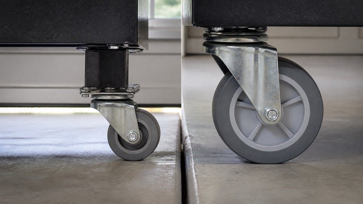 Small and large caster wheels facing the same concrete floor joint